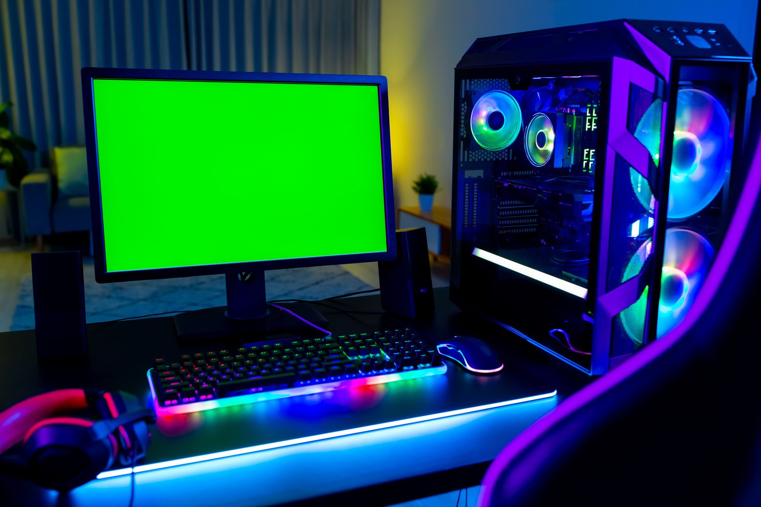 Gaming Computer with Green Monitor Screen and Glowing Lights